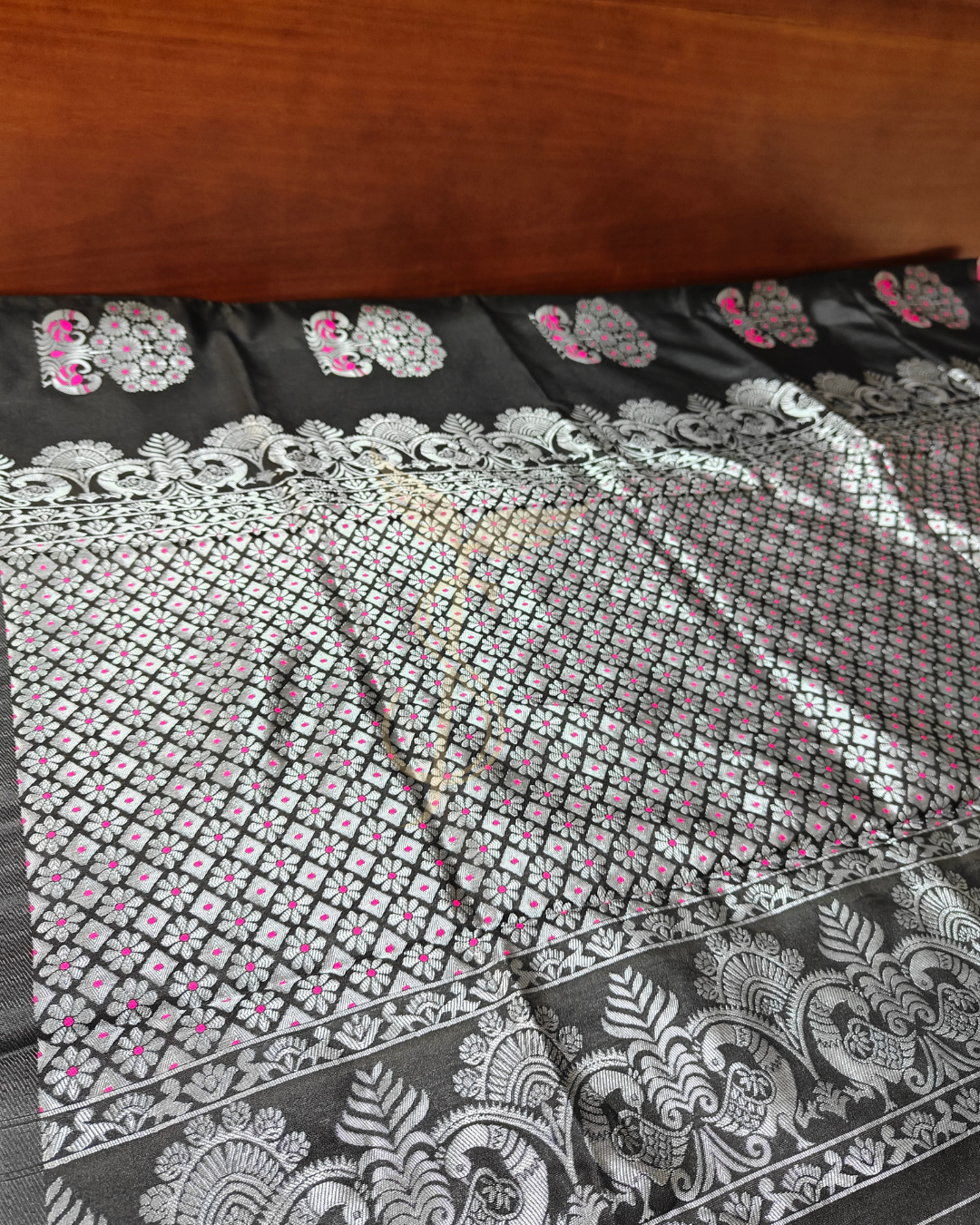 Black Banarasi Jari Silken Saree with pink peacock motifs and silver Zari
