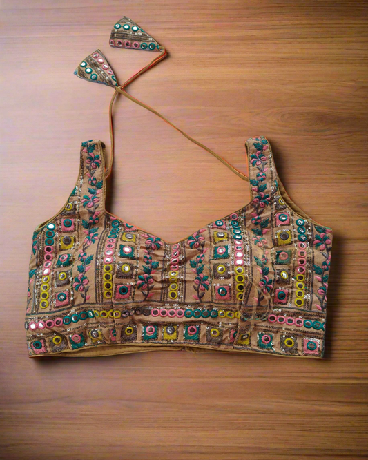 Decorative blouse with colorful patterns on a textured surface